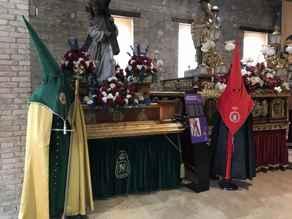 Penitential robes, capirote hoods, and ceremonial floats on display at the Museo de la Semana Santa Marinera, a cultural stop among the meaningful things to do in Valencia.