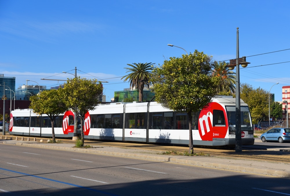 Metrovalencia streetcar traveling through the city, a simple and accessible option for reaching the beaches and exploring popular things to do in Valencia.