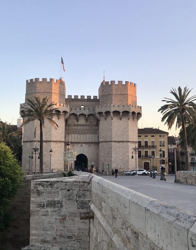 Torres de Serranos at sunset in Valencia, one of the most striking historic things to do in Valencia.